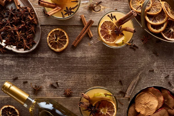 Top view of pear mulled wine with spices on wooden rustic table — Stock Photo
