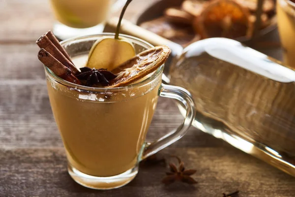 Seasonal traditional pear mulled wine with spices in glass — Stock Photo