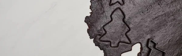 Top view of raw dough for chocolate Christmas cookies on white background, panoramic shot — Stock Photo