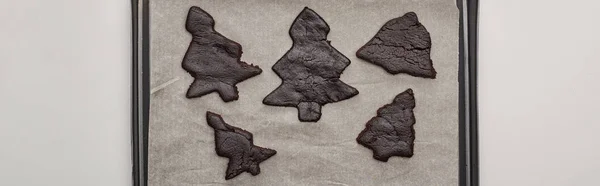 Top view of raw Christmas tree cookies on oven tray, panoramic shot — Stock Photo