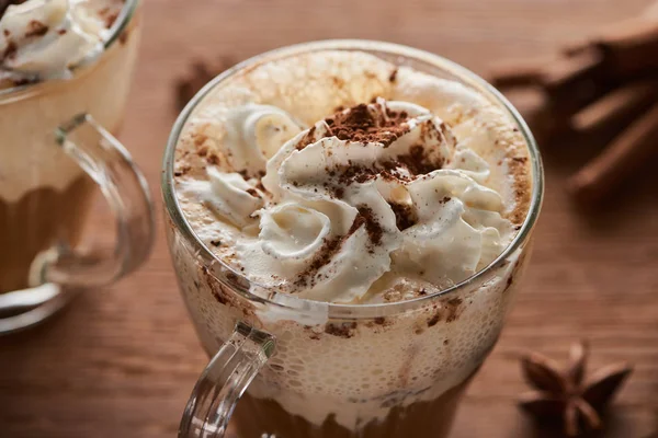 Close up view of Christmas cacao with whipped cream on wooden table — Stock Photo