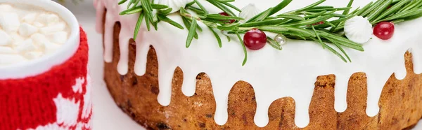 Close up of christmas pie with icing on white wooden table with cup of cocoa — Stock Photo