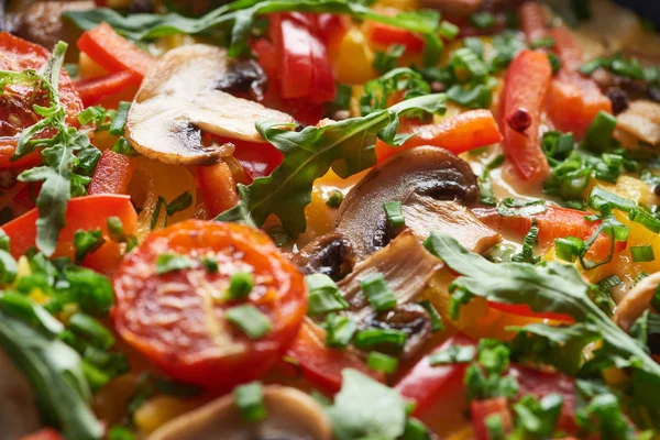 Close up of tasty homemade omelet with mushrooms, tomatoes and greens — Stock Photo