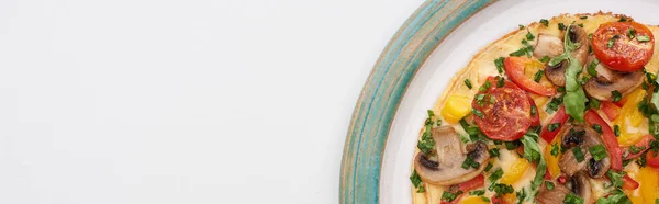 Top view of tasty omelet with tomatoes and mushrooms for breakfast on white table — Stock Photo