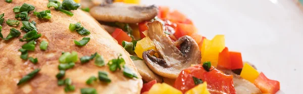 Close up of yummy wrapped omelet with vegetables on plate — Stock Photo