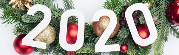 Top view of 2020 numbers on Christmas tree wreath on white background, panoramic shot — Stock Photo