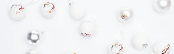 Top view of silver and  white baubles on white background, panoramic shot — Stock Photo