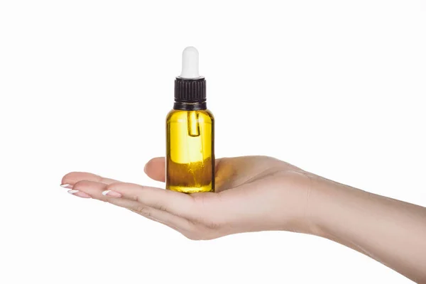 Cropped view of woman holding bottle with natural serum isolated on white — Stock Photo