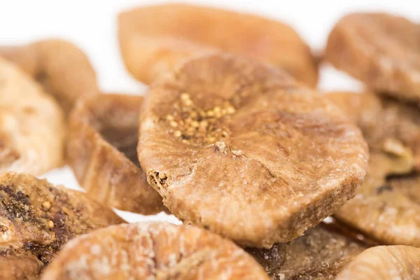 Close up view of delicious dried figs isolated on white — Stock Photo