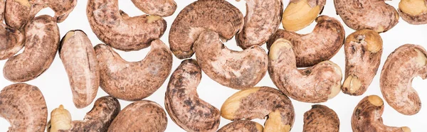 Top view of cashew nuts isolated on white, panoramic shot — Stock Photo