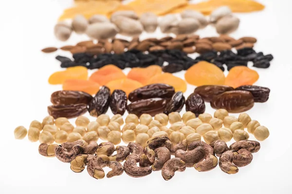 Selective focus of assorted turkish dried fruits and nuts isolated on white — Stock Photo