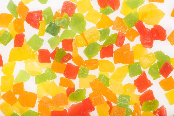 Vista superior de frutas cristalizadas deliciosas coloridas isoladas em branco — Fotografia de Stock