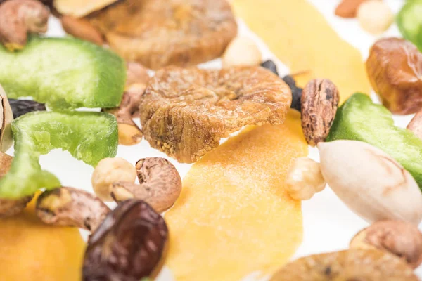 Close up view of Turkish assorted nuts, dried fruits and candied fruit isolated on white — Stock Photo