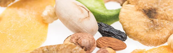 Close up view of Turkish assorted nuts, dried fruits and candied fruit isolated on white, panoramic shot — Stock Photo