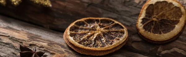 Dried citrus slices with anise on wooden background, panoramic shot — Stock Photo