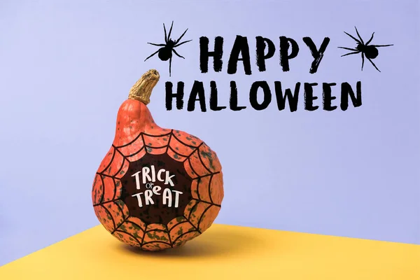 Orange Halloween pumpkin on violet and yellow background with spiders, spiderweb and happy Halloween illustration — Stock Photo