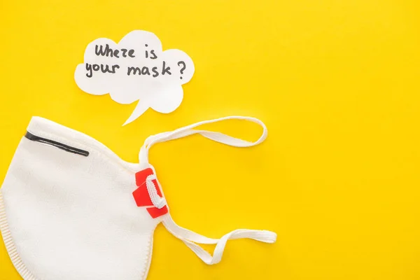 Top view of safety mask with speech bubble on yellow background — Stock Photo