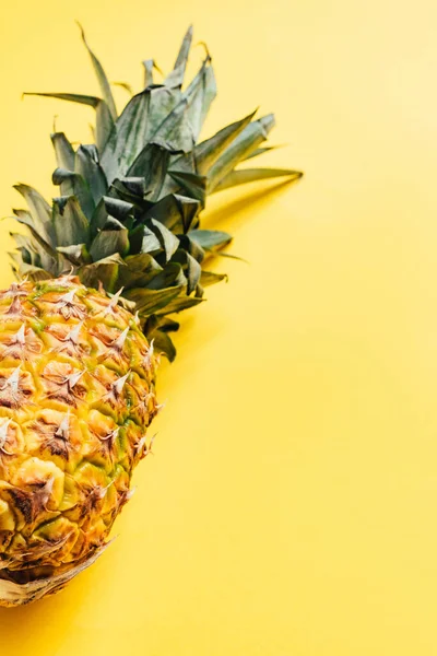 Fresh ripe pineapple on yellow background — Stock Photo