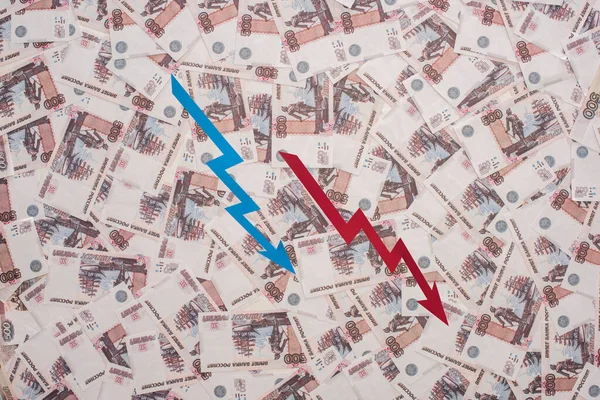 KYIV, UKRAINE - MARCH 25, 2020: top view of crisis graphs near russian rubles — Stock Photo