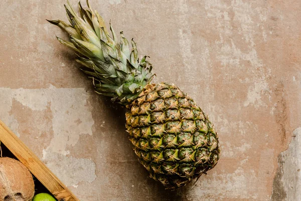 Top view of ripe pineapple on weathered surface — Stock Photo
