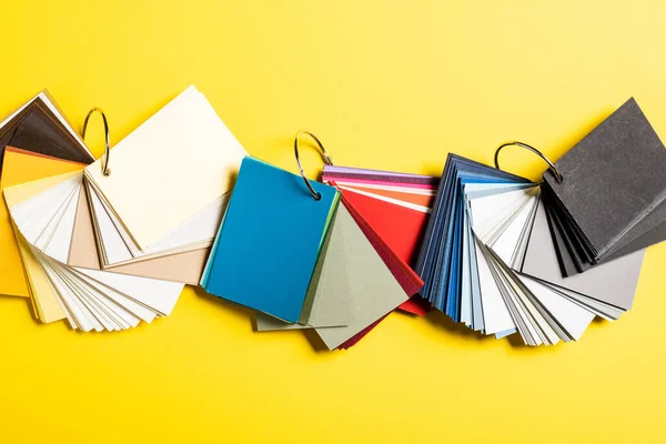 Top view of blank colorful samples on yellow — Stock Photo