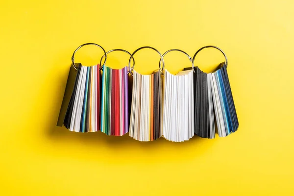 Top view of colorful samples set on yellow — Stock Photo