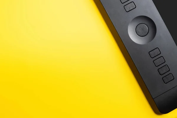 Top view of drawing tablet on yellow — Stock Photo