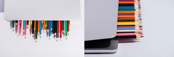 Collage de crayons de couleur dans un ordinateur portable moderne sur fond blanc, prise de vue panoramique — Photo de stock