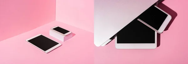 Collage of pink workplace with modern gadgets, panoramic shot — Stock Photo