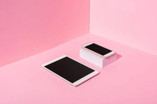 Modern gadgets with blank screens on pink background — Stock Photo