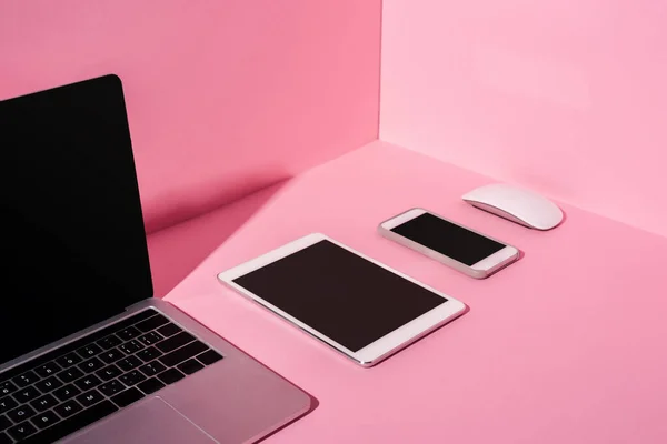 Modern gadgets with blank screens on pink background — Stock Photo