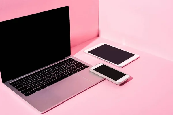 Modern gadgets with blank screens on pink background — Stock Photo