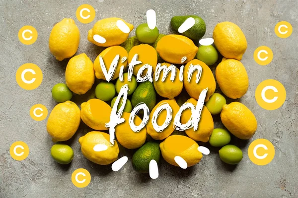 Vista dall'alto di avocado colorato, lime e limoni sulla superficie di cemento grigio, illustrazione di alimenti vitaminici — Foto stock