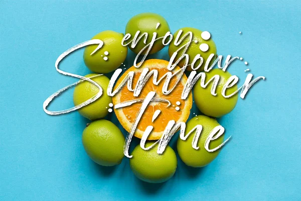 Top view of ripe orange and limes arranged in circle on blue background, enjoy your summertime illustration — Stock Photo