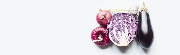 Top view of red onion, red cabbage, eggplant and garlic on white background, panoramic shot — Stock Photo