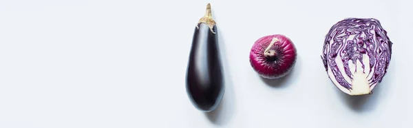 Flat lay with red onion, red cabbage, eggplant on white background, panoramic shot — Stock Photo