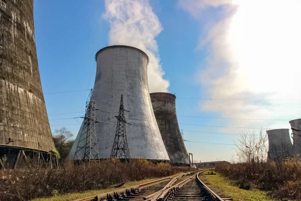Steam comes out of the power plant cooling towers