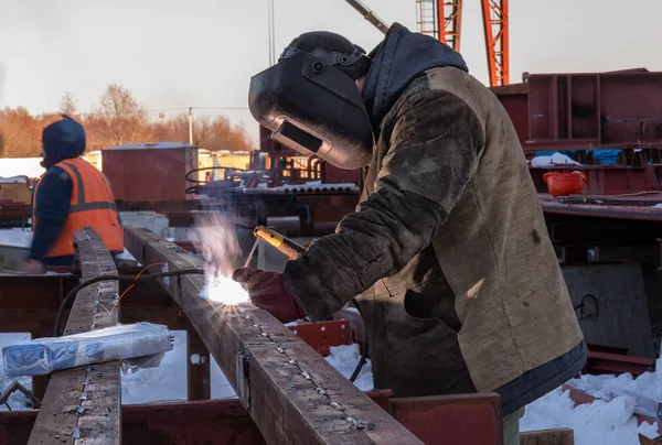 Welder protective mask works outdoors in winter