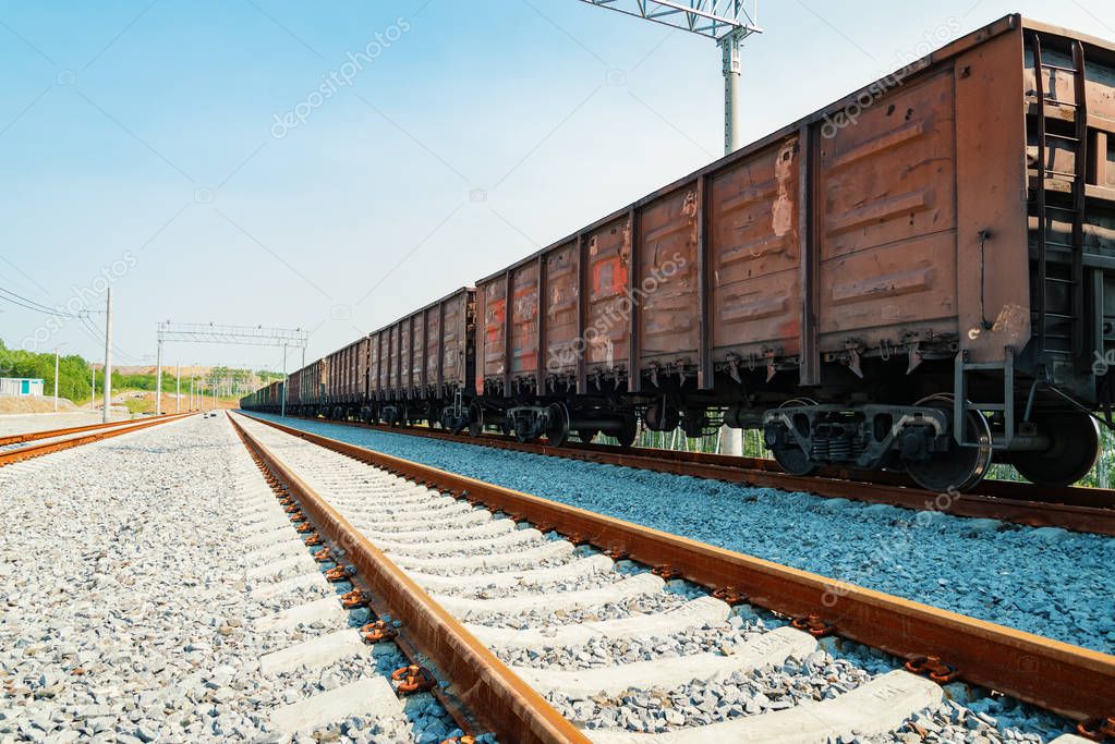 Train cars are on the rails