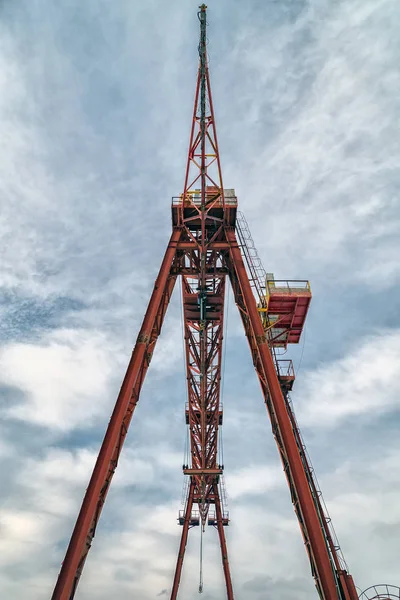 Gantry crane on background sky on a construction site