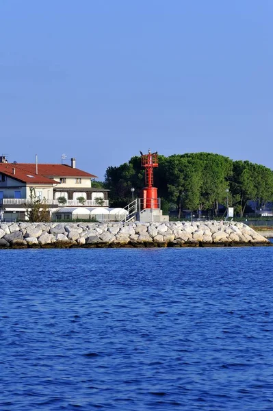 Modern signaling lighthouse for boats in the sea on the pier