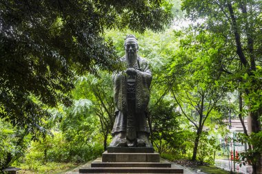Tokyo, Japan. Bronze statue of Confucius, Chinese politician and philosopher, at Yushima Seido, a Confucian temple in the Yushima neighbourhood of Bunkyo clipart