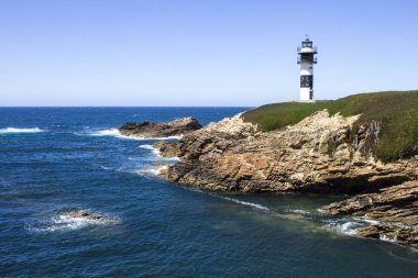 Illa gökhan Ribadeo, İspanya, Galiçya ve Asturias arasındaki sınır sınırlandırır Eo Haliç koruyan iki fenerler ile güzel bir ada.