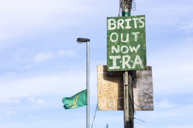 Derry, Northern Ireland. A Brits Out Now IRA sign in Bogside neighbourhood clipart