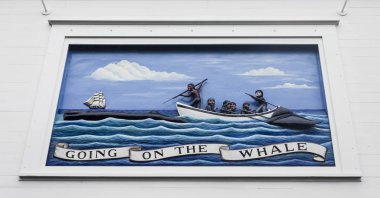 Nantucket, Massachusetts. Painted mural relief representing a hunting of whales scene in the facade of the Nantucket Whaling Museum