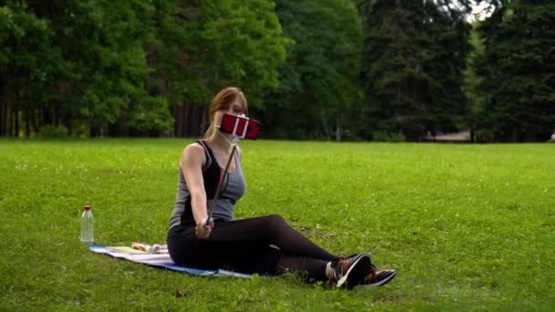 Girl takes a selfie in nature day — Stock Video