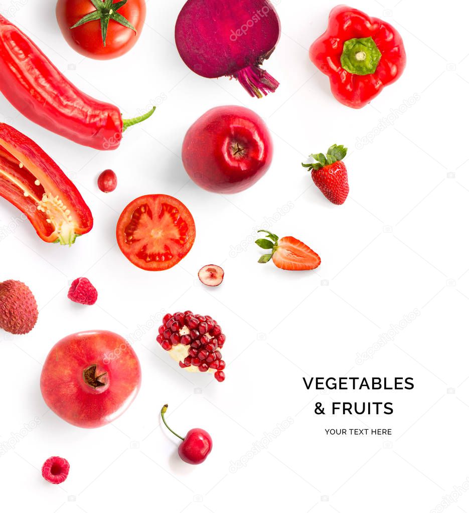 Creative layout made of red vegetables and fruits. Flat lay. Food concept. Tomato, red apple, pomegranate, red pepper, raspberry, strawberry, cherry,  beetroot and lychee on the white background.