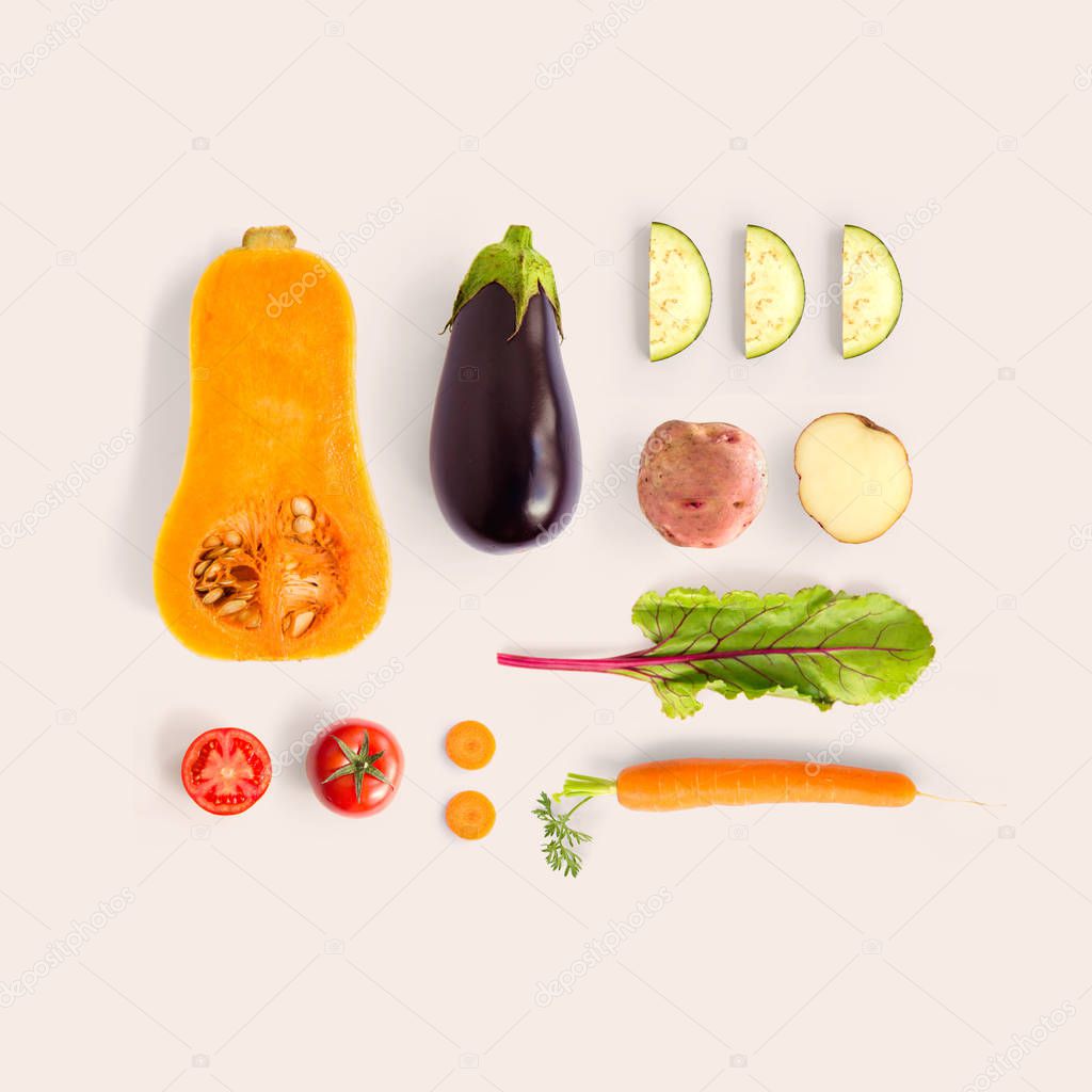Creative layout made of pumpkin, carrot, tomato, eggplant, zucchini  and potato. Flat lay. Food concept.