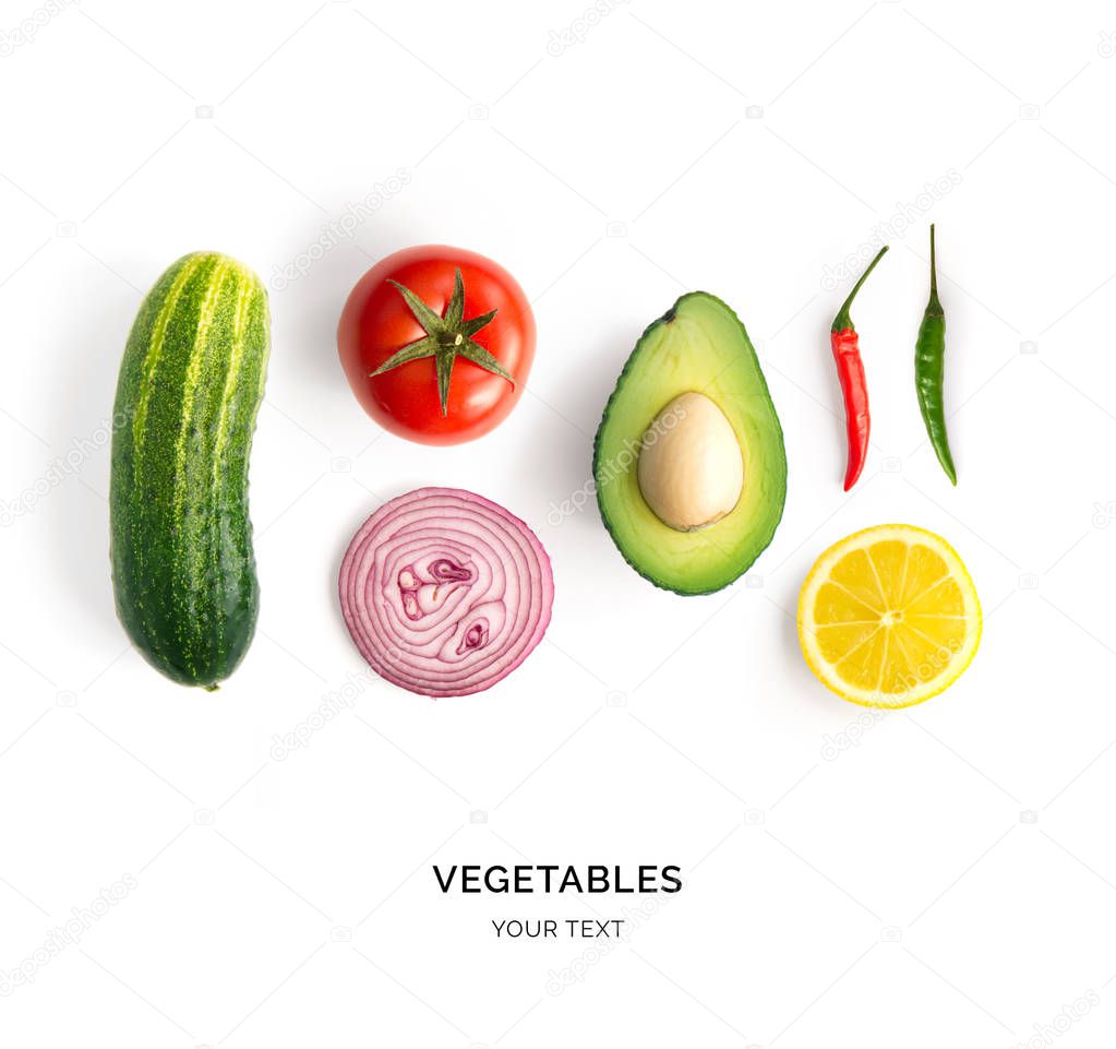 Creative layout made of avocado, onion, tomatoes, pepper and lemon. Flat lay. Food concept. Vegetables isolated on white background.