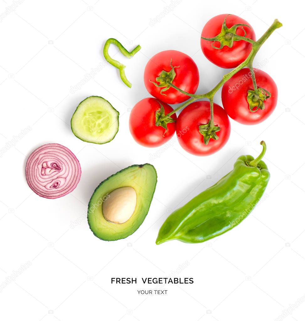 Creative layout made of tomato, onion, green pepper, cucumber and avocado. Flat lay. Food concept. Vegetables isolated on white background.
